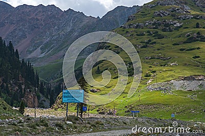 Beautiful mountains with rocky terrain and sky background. Barskoon river gorge. Road to Kumtor gold mine. Natural background Stock Photo