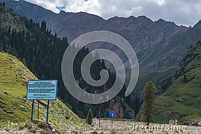 Beautiful mountains with rocky terrain and sky background. Barskoon river gorge. Road to Kumtor gold mine. Natural background Stock Photo