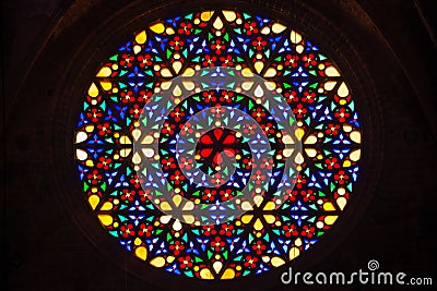 Beautiful multi colored stained glass rose window with flower prints Stock Photo