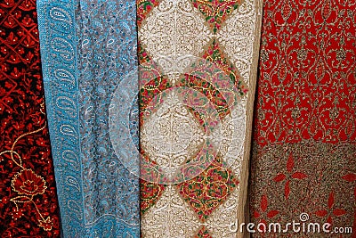 Beautiful multicolored pashmina shawls handmade, decorated with fancy patterns and shiny gems Stock Photo
