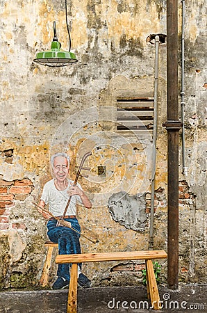 Beautiful mural art of the uncle playing erhu painted at the Kwai Chai Hong`s lane Prankster lane Editorial Stock Photo