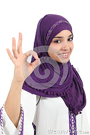 Beautiful muslim woman wearing a hijab gesturing ok Stock Photo