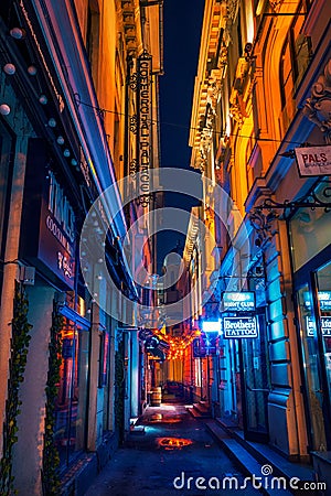 Beautiful narrow alley with night clubs and cocktail bars shot i Editorial Stock Photo