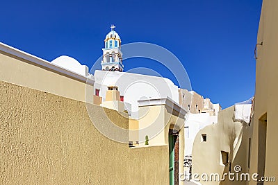 The beautiful narrow colorful streets of Emporio, Santorini, Greece with church towers where you look Stock Photo