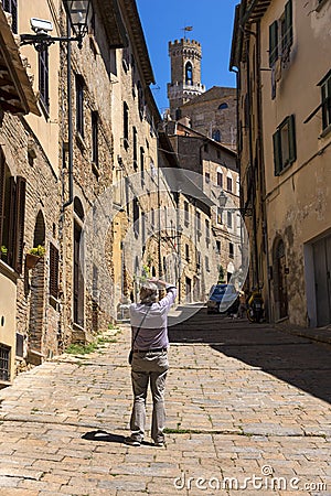 Beautiful narrow street of historic tuscan city Volterra Editorial Stock Photo