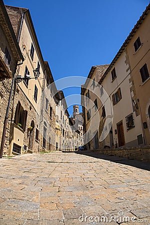 Beautiful narrow street of historic tuscan city Volterra Editorial Stock Photo