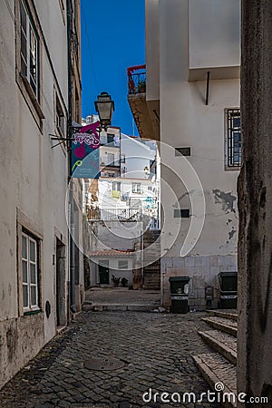Beautiful narrow streets, houses and shops in the old town of Alfama. Mediterranean, Lisbon, Portugal Editorial Stock Photo