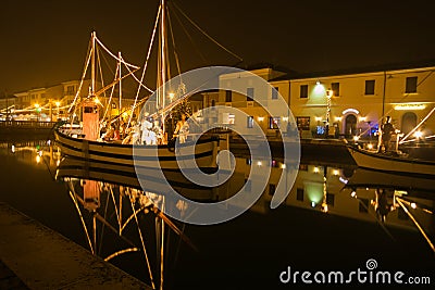 Beautiful nativity scene in the boats in the canal of the city, Italy Editorial Stock Photo