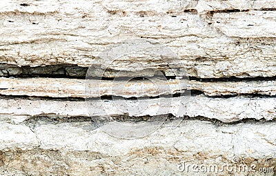 Beautiful natural cliff surface white limestone background. Multiple layer rock pattern with horizontal lines. Great texture for Stock Photo