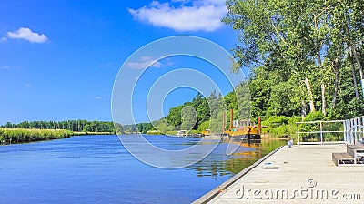 Beautiful natural landscape panorama jetty boat Oste river water Germany Stock Photo