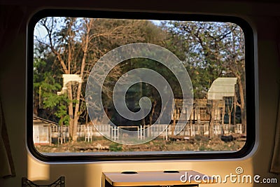 Beautiful nature landscape view from the window of the train. Selective focus and shallow depth of field. Stock Photo