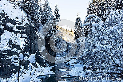Beautiful nature lanscape Caucasus mountain river and pine forest covered with snow in winter Mestia Georgia Stock Photo