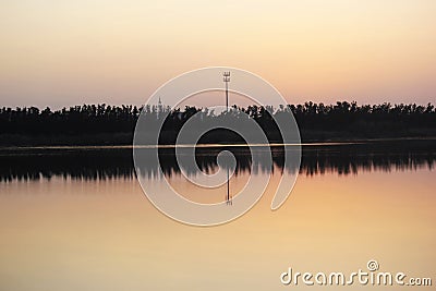Beautiful nature scenery of water, trees and sky shadows in the water. Stock Photo
