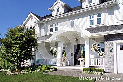 Beautiful new luxury home exterior in summer. Stock Photo