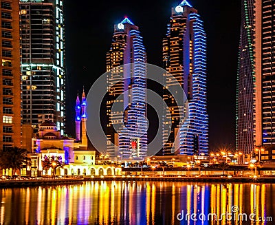 Beautiful night lights at Dubai Marina - city skyscrapers and residential towers - mosque view Editorial Stock Photo