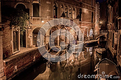 Beautiful night scenery of the canal and endless streets of Venice Editorial Stock Photo