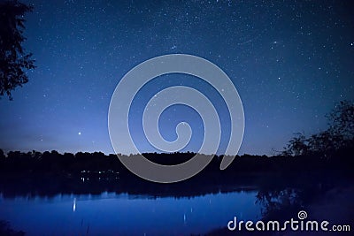 Beautiful night sky with many stars on a lake Stock Photo