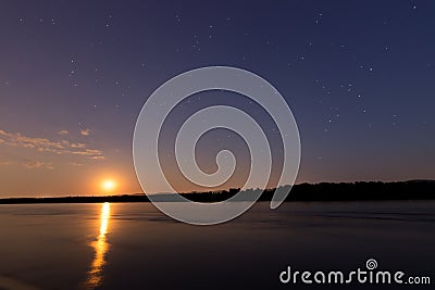 Beautiful night sky with moon and constellation over Danube river Stock Photo