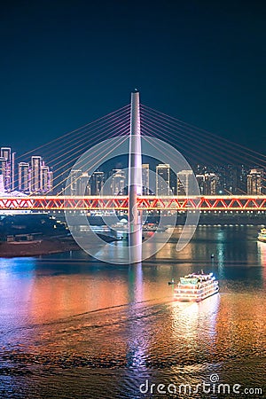 Beautiful night view of a colorful cruise ship traveling on River Editorial Stock Photo