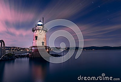 Beautiful night view of the Tarrytown Lighthouse in Sleepy Hollow, NY, with long exposure clouds Stock Photo