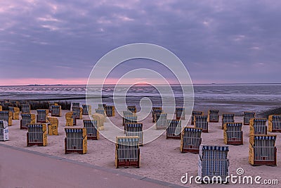 Beautiful North Sea coast of Cuxhaven in Germany. Overcast sky with clouds over the sea at low tide Stock Photo
