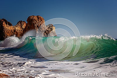 Beautiful ocean landscape, turquoise wave crashes on the shore on the Atlantic coast Stock Photo