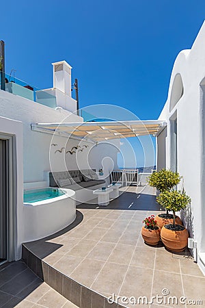 Beautiful Oia town on Santorini island, Greece. Wonderful scenery of white resort or hotel architecture, blue sky and sea view. Stock Photo