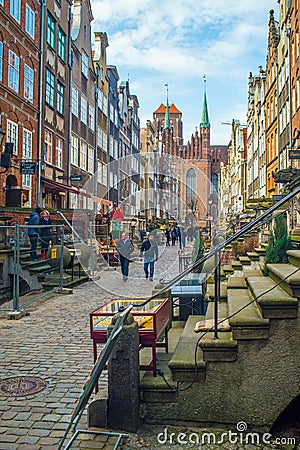 Beautiful Mariacka Street in Old Town in Gdansk with old houses and gothic St. Mary's church Editorial Stock Photo