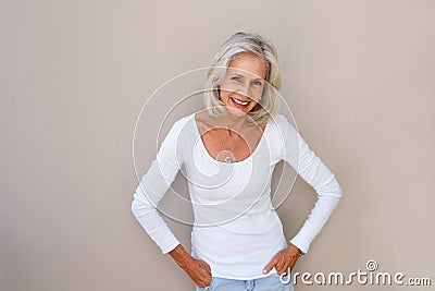 Beautiful older woman standing and smiling Stock Photo