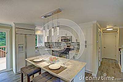 Beautiful open plan second floor white kitchen Stock Photo