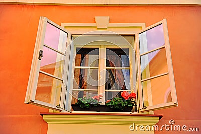 Beautiful open window in orange stone house Stock Photo