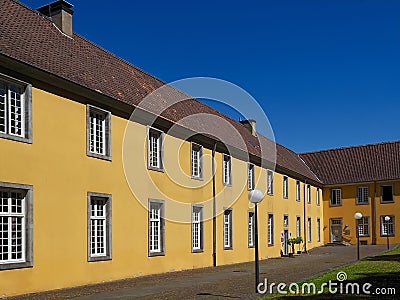 Beautiful orangery at the castle Schloss Benrath in Duesseldorf in Germany with a big park and white sculptures Editorial Stock Photo