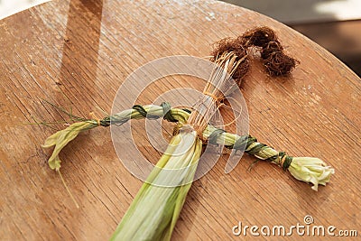 Beautiful original small straw doll handmade is made on motives of folk traditions Stock Photo