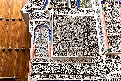 Beautiful ornate relief at a facade of a madrasa in Fes, a Koran school Stock Photo