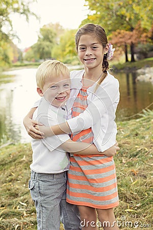 Beautiful outdoor portrait of a cute boy and girl Stock Photo