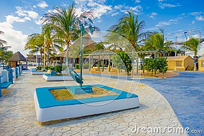 Beautiful outdoor view of the pier with some palms tree in Puerto Morelos in Mayan Riviera Maya of Mexico Stock Photo