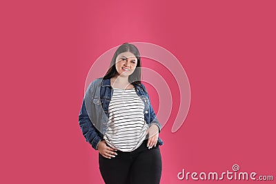 Beautiful overweight woman posing on background. Plus size model Stock Photo