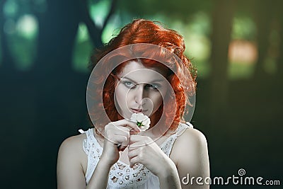 Beautiful pale vampire with red hair Stock Photo