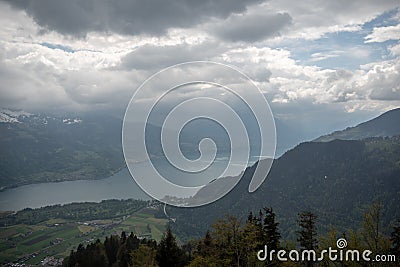 Beautiful panorama view of lake Thun with mountain and cloudy sky looking from harder kulm Stock Photo
