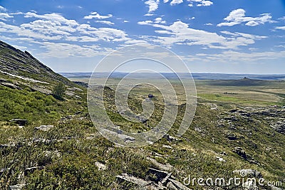 Beautiful panoramic summer steppe landscape of stone mountains Stock Photo