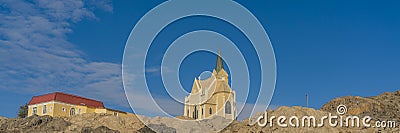 Beautiful panoramic view of the protestant german colonial church Felsenkirche in Luederitz, Luderitz in Namibia Stock Photo