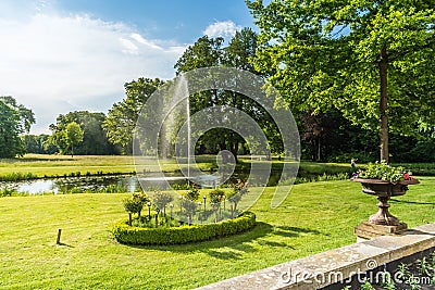 Beautiful park with pond with fountain Stock Photo