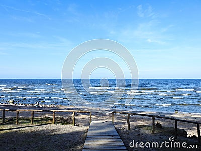 Wooden path going to sea, Lithuania Stock Photo