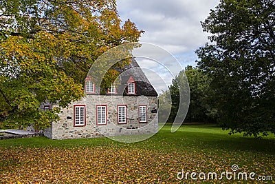 Beautiful patrimonial two-chimneyed stone presbytery seen in the fall in Deschambault-Grondines Stock Photo