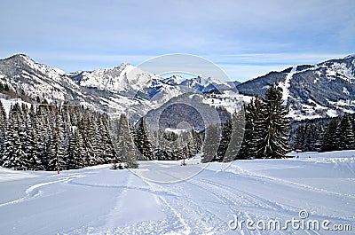 Beautiful peaceful winter landscape in the Frence Alps, at one of the ski stations, France. The view on the empty ski slopes Stock Photo