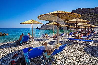 The beautiful pebbled beach of Chalkos in Kythera. Amazing scenery with crystal clear water and a small rocky gulf in Kythera Editorial Stock Photo