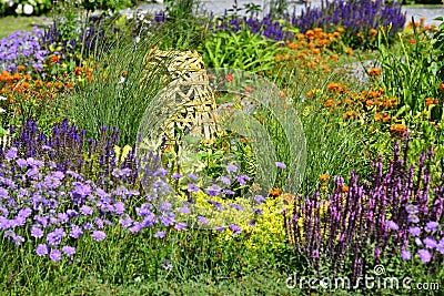 a beautiful perenial garden with bamboo ornament Stock Photo