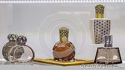 Beautiful perfume and air fragrance bottles. Glass jar with carved plastic lid for aromatic liquid Stock Photo