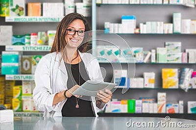 Beautiful Pharmacist with Digital Tablet Stock Photo