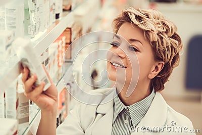 Beautiful pharmacist at work Stock Photo